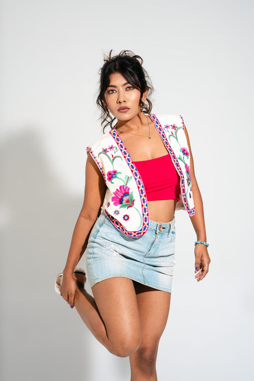 Detailed embroidery view of the Amara Peoni Waistcoat in bright peoni hues — perfect for holiday outfits