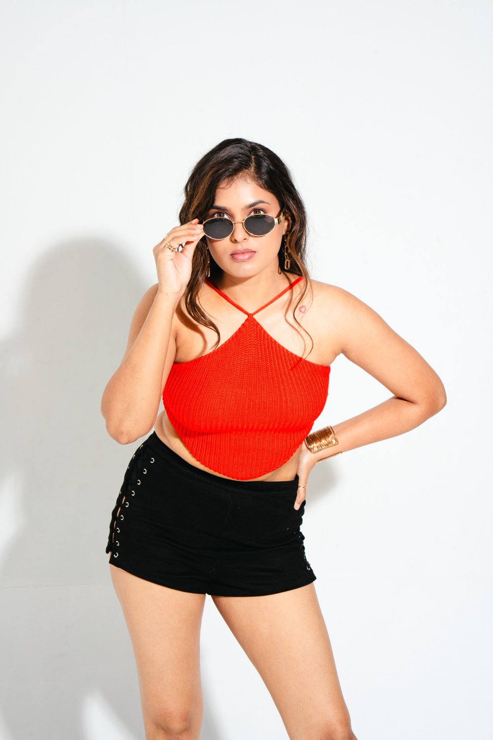 Front close-up of Gia Sangria Red knitted crop top showing textured knit and flattering pointed hem