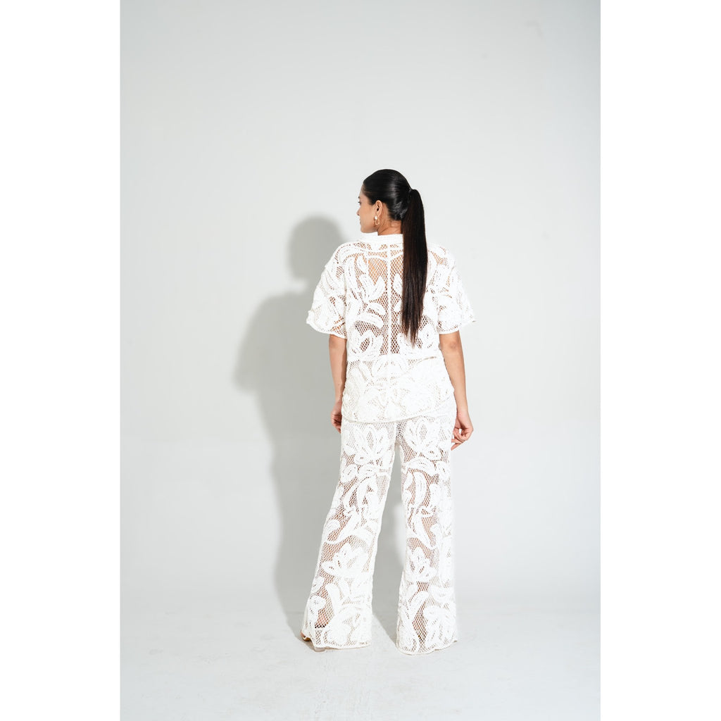 Back view of the Laurel Crochet Full Length Coord Set, displaying the open-knit floral pattern and elegant long pants for beach and resort styling
