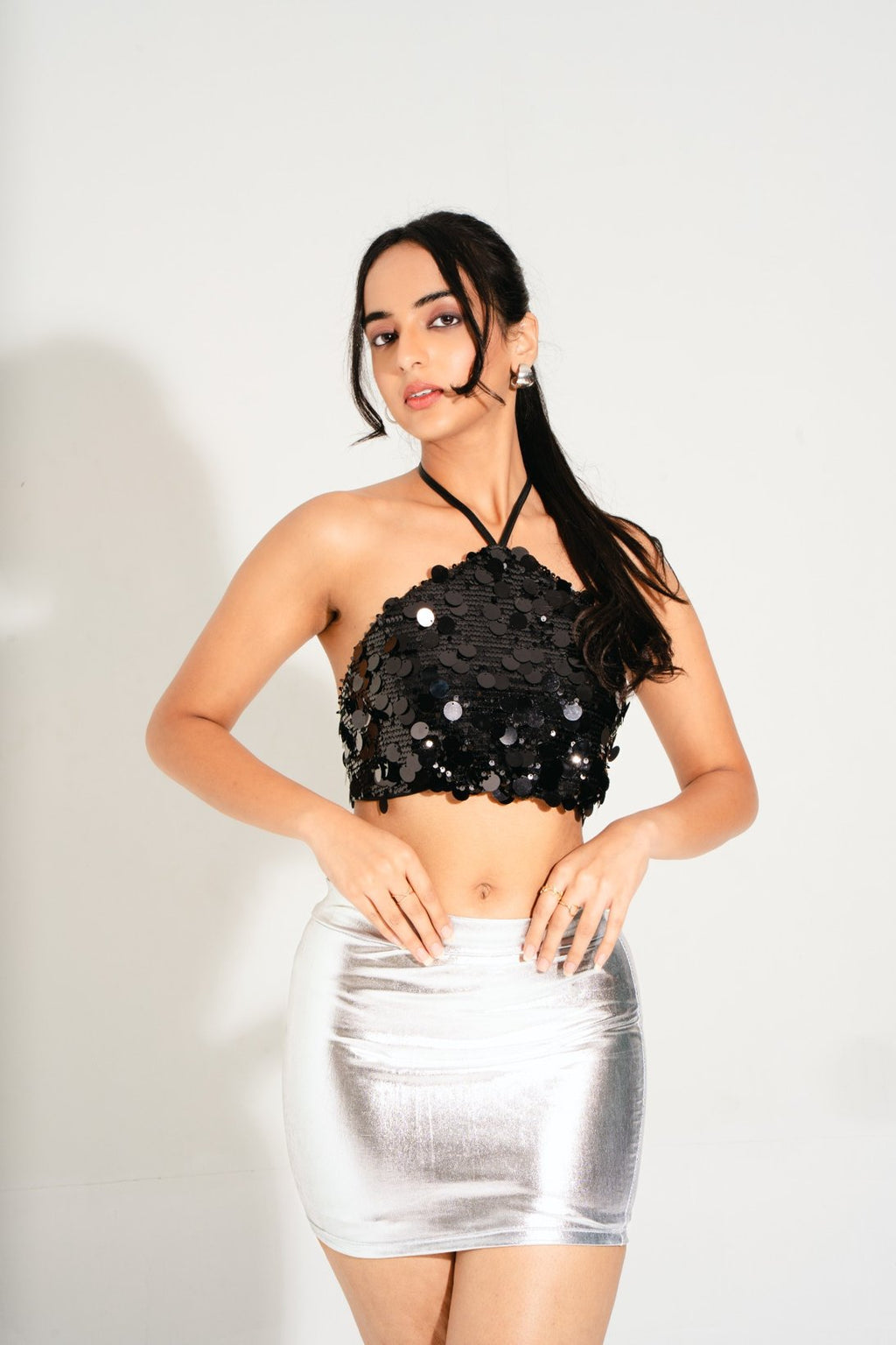 Lunar Black Lulu Halter Sequin Top – angled pose highlighting shine, festival and evening glamour wear.