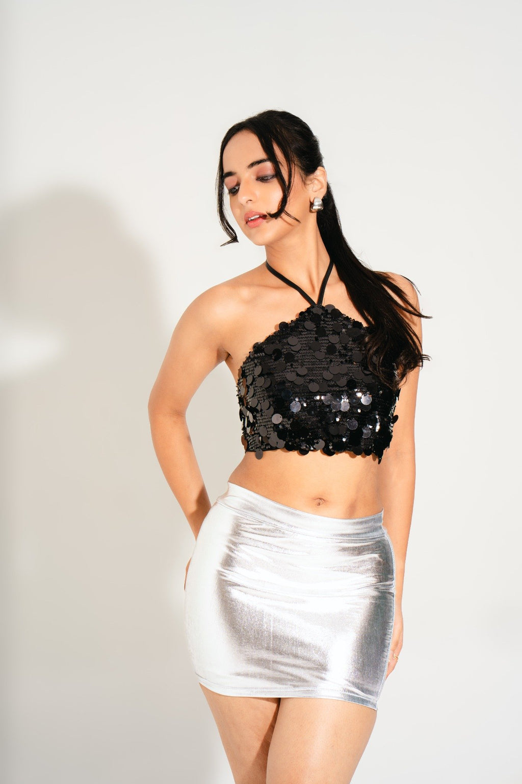 Close-up of Lunar Black Lulu Halter Sequin Top showing premium sequin detailing and luxe texture